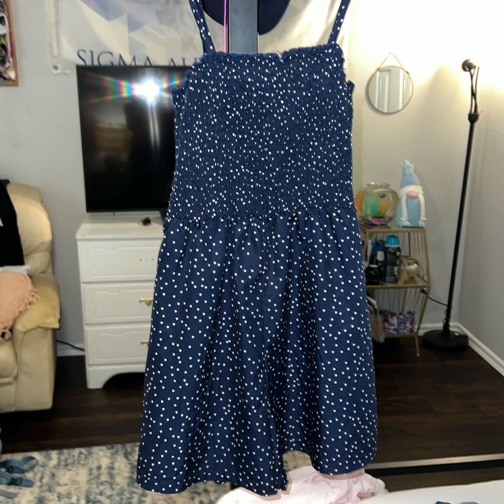 navy blue polka-dotted romper